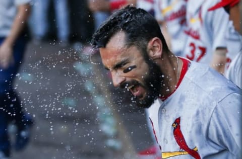 Jun 26, 2016; Seattle, WA, USA; St. Louis Cardinals second baseman Matt Carpenter (13) after being splashed with a cup of water for hitting a home run during the ninth inning against the Seattle Mariners at Safeco Field. The Cardinals won 11-6. Mandatory Credit: Jennifer Buchanan-USA TODAY Sports