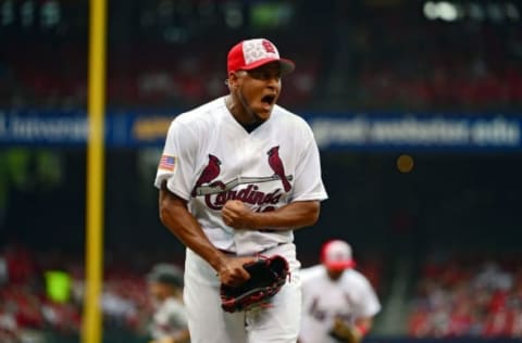 Jul 4, 2016; St. Louis, MO, USA; St. Louis Cardinals starting pitcher Carlos Martinez (18) reacts as he walks off the field after giving up a one run single to Pittsburgh Pirates first baseman John Jaso (not pictured) during the seventh inning at Busch Stadium. Mandatory Credit: Jeff Curry-USA TODAY Sports