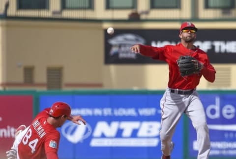 Mar 21, 2016; Jupiter, FL, USA; Boston Red Sox second baseman Deven Marrero (16) attempts to turn a double play over St. Louis Cardinals catcher Mike Ohlman (84) during the game at Roger Dean Stadium. The Red Sox defeated the Cardinals 4-3. Mandatory Credit: Scott Rovak-USA TODAY Sports