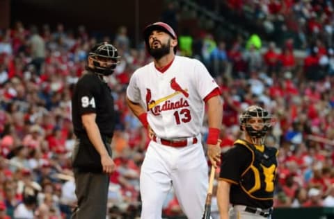 Jul 6, 2016; St. Louis, MO, USA; St. Louis Cardinals second baseman Matt Carpenter (13) holds his side after a swing during the third inning against the Pittsburgh Pirates at Busch Stadium. Carpenter left the game with a right oblique injury. Mandatory Credit: Jeff Curry-USA TODAY Sports