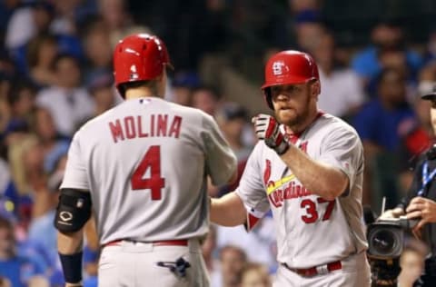 Aug 14, 2016; Chicago, IL, USA; St. Louis Cardinals first baseman Brandon Moss (37) celebrates with catcher Yadier Molina (4) after hitting a home run in the seventh inning against the Chicago Cubs at Wrigley Field. Mandatory Credit: Caylor Arnold-USA TODAY Sports