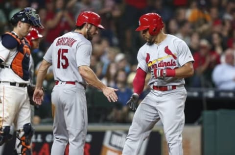 Aug 16, 2016; Houston, TX, USA; St. Louis Cardinals left fielder Tommy Pham (28) celebrates with center fielder Randal Grichuk (15) after hitting a home run during the fifth inning against the Houston Astros at Minute Maid Park. Mandatory Credit: Troy Taormina-USA TODAY Sports