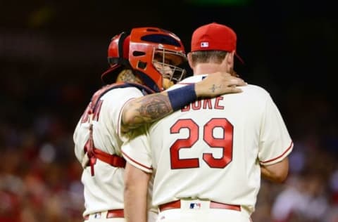 Aug 6, 2016; St. Louis, MO, USA; St. Louis Cardinals catcher Yadier Molina (4) talks with relief pitcher Zach Duke (29) during the eighth inning against the Atlanta Braves at Busch Stadium. The Braves won 13-5. Mandatory Credit: Jeff Curry-USA TODAY Sports