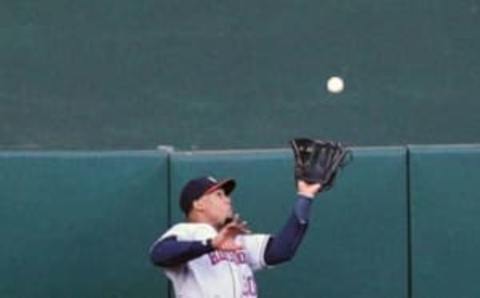 Jul 18, 2016; Oakland, CA, USA; Houston Astros center fielder Carlos Gomez (30) catches a deep fly ball from Oakland Athletics third baseman Ryon Healy (48) in the second inning of their MLB baseball game at O.co Coliseum. Mandatory Credit: Lance Iversen-USA TODAY Sports