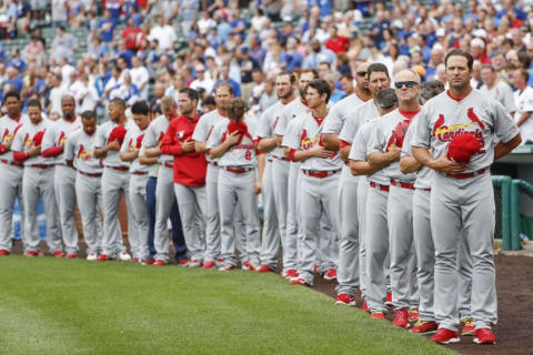 Aug 12, 2016; Chicago, IL, USA; St. Louis Cardinals listen to the national anthem before the baseball game against the Chicago Cubs at Wrigley Field. Mandatory Credit: Kamil Krzaczynski-USA TODAY Sports