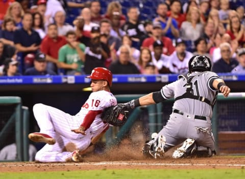 Sep 21, 2016; Philadelphia, PA, USA; Philadelphia Phillies second baseman Cesar Hernandez (16) slides safely into home as Chicago White Sox catcher Alex Avila (31) can