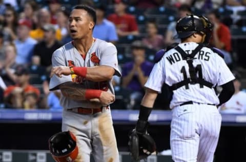 Sep 20, 2016; Denver, CO, USA; St. Louis Cardinals second baseman Kolten Wong (16) reacts after not being to score a run in the first inning against the Colorado Rockies at Coors Field. Mandatory Credit: Ron Chenoy-USA TODAY Sports