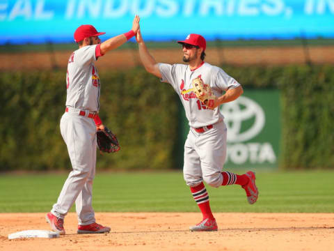 Sep 24, 2016; Chicago, IL, USA; St. Louis Cardinals third baseman Matt Carpenter (13) and center fielder Randal Grichuk (15) celebrate the final out of the ninth inning against the Chicago Cubs at Wrigley Field. Mandatory Credit: Dennis Wierzbicki-USA TODAY Sports