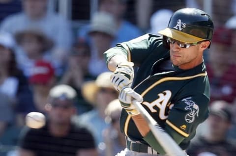 Mar 4, 2016; Salt River Pima-Maricopa, AZ, USA; Oakland Athletics left fielder Sam Fuld (23) hits in the first inning against the Arizona Diamondbacks during a spring training game at Salt River Fields at Talking Stick. Mandatory Credit: Rick Scuteri-USA TODAY Sports