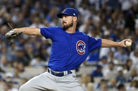 Oct 18, 2016; Los Angeles, CA, USA; Chicago Cubs relief pitcher Travis Wood (37) pitches during the sixth inning against the Los Angeles Dodgers in game three of the 2016 NLCS playoff baseball series at Dodger Stadium. Mandatory Credit: Richard Mackson-USA TODAY Sports