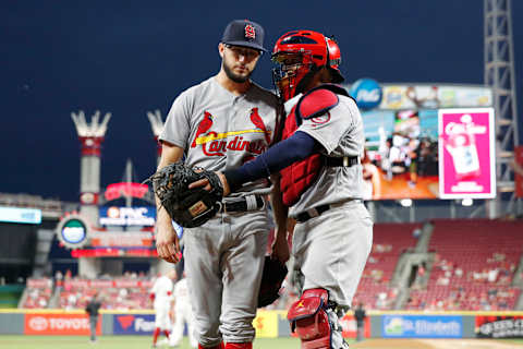 CINCINNATI, OH – JULY 23: Daniel Poncedeleon #62 of the St. Louis Cardinals gets a hug from Yadier Molina #4 after pitching the seventh inning against the Cincinnati Reds during a game at Great American Ball Park on July 23, 2018 in Cincinnati, Ohio. Poncedeleon came out of the game after pitching a no-hitter through seven innings but the Reds won 2-1. (Photo by Joe Robbins/Getty Images)