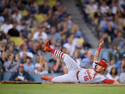 LOS ANGELES, CA – AUGUST 21: Kolten Wong #16 of the St. Louis Cardinals slides home, after a Jose Martinez #38 single, to tie the game 1-1 with the Los Angeles Dodgers during the third inning at Dodger Stadium on August 21, 2018 in Los Angeles, California. (Photo by Harry How/Getty Images)