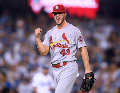 LOS ANGELES, CA – AUGUST 22: Dakota Hudson #43 of the St. Louis Cardinals celebrates a groundball out of Manny Machado #8 of the Los Angeles Dodgers to end the eighth inning at Dodger Stadium on August 22, 2018 in Los Angeles, California. (Photo by Harry How/Getty Images)