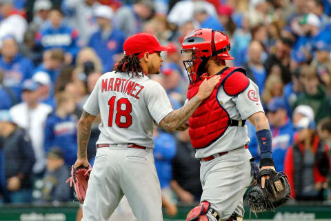 CHICAGO, IL – SEPTEMBER 29: Carlos Martinez #18 of the St. Louis Cardinals (L) and Yadier Molina #4 celebrate their win over the Chicago Cubs at Wrigley Field on September 29, 2018 in Chicago, Illinois. The St. Louis Cardinals won 2-1. (Photo by Jon Durr/Getty Images)