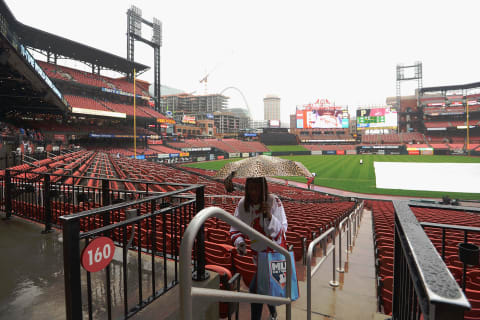 ST. LOUIS, MO – MAY 11: A woman walks to cover during a rain shower prior to a game between the Pittsburgh Pirates and St. Louis Cardinals at Busch Stadium on May 11, 2019 in St. Louis, Missouri. (Photo by Michael B. Thomas /Getty Images)