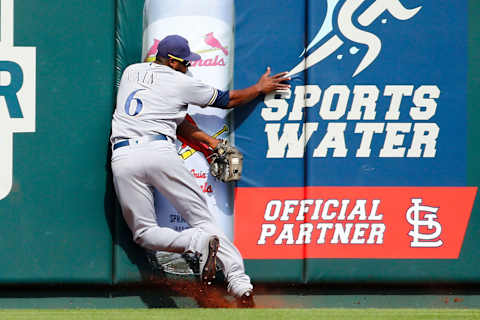 ST LOUIS, MO – SEPTEMBER 15: Lorenzo Cain #6 of the Milwaukee Brewers crashes into the wall after catching a fly ball against the St. Louis Cardinals in the seventh inning at Busch Stadium on September 15, 2019 in St Louis, Missouri. (Photo by Dilip Vishwanat/Getty Images)