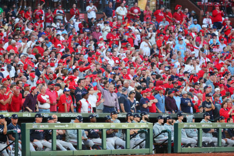 ST. LOUIS, MO – OCTOBER 07: Cardinals fans cheer behind the Atlanta Braves dugout after the score is tied in the eighth inning during Game 4 of the NLDS between the Atlanta Braves and the St. Louis Cardinals at Busch Stadium on Monday, October 7, 2019 in St. Louis, Missouri. (Photo by Dilip Vishwanat/MLB Photos via Getty Images)