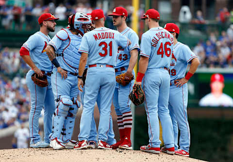 CHICAGO, ILLINOIS – SEPTEMBER 21: Pitching coach Mike Maddux #31 of the St. Louis Cardinals visits the mound to speak with Dakota Hudson #43 during the first inning of a game against the Chicago Cubs at Wrigley Field on September 21, 2019 in Chicago, Illinois. (Photo by Nuccio DiNuzzo/Getty Images)