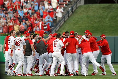 ST LOUIS, MISSOURI – OCTOBER 07: Yadier Molina #4 of the St. Louis Cardinals is congratulated by his teammates after he hits a walk-off sacrifice fly to give his team the 5-4 win over the Atlanta Braves in game four of the National League Division Series at Busch Stadium on October 07, 2019 in St Louis, Missouri. (Photo by Scott Kane/Getty Images)