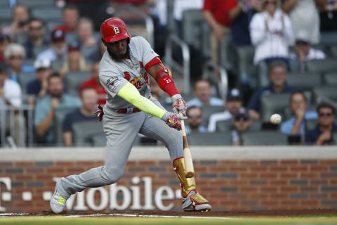 Marcell Ozuna #23 of the St. Louis Cardinals hits an RBI single against the Atlanta Braves. (Photo by Todd Kirkland/Getty Images)