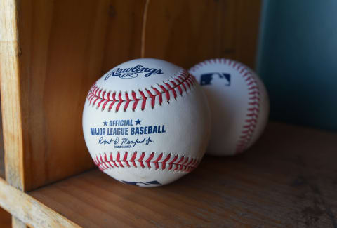 LAKELAND, FL – MARCH 01: A detailed view of a pair of official Rawlings Major League Baseball baseballs with the imprinted signature of Robert D. Manfred Jr., the Commissioner of Major League Baseball, sitting in the dugout prior to the Spring Training game between the New York Yankees and the Detroit Tigers at Publix Field at Joker Marchant Stadium on March 1, 2020 in Lakeland, Florida. The Tigers defeated the Yankees 10-4. (Photo by Mark Cunningham/MLB Photos via Getty Images)