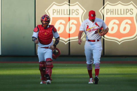 ST LOUIS, MO – JUNE 03: Yadier Molina #4 and Adam Wainwright #50 of the St. Louis Cardinals make their way to the dugout prior to a game against the Cincinnati Reds at Busch Stadium on June 3, 2021 in St Louis, Missouri. The pair made their 284th start together, the fourth-most starts among pitcher-catcher batteries in MLB history. (Photo by Dilip Vishwanat/Getty Images)