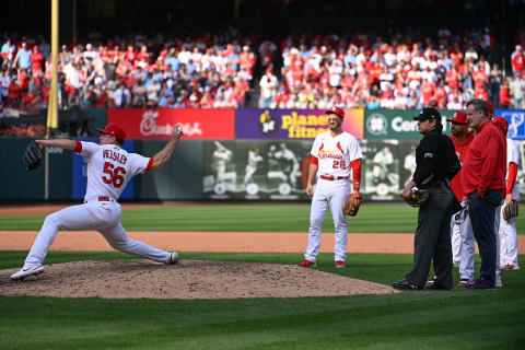 Ryan Helsley #56 of the St. Louis Cardinals pitches while Manager Oliver Marmol #37 of the St. Louis Cardinals and training staff watch. (Photo by Joe Puetz/Getty Images)