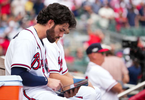 Dansby Swanson #7 of the Atlanta Braves looks at a tablet on the bench during the third inning against the Philadelphia Phillies. (Photo by Kevin D. Liles/Atlanta Braves/Getty Images)