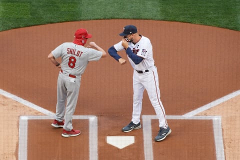 MINNEAPOLIS, MINNESOTA – JULY 28: Mangers Mike Shildt #8 of the St. Louis Cardinals and Rocco Baldelli #5 of the Minnesota Twins greet each other at home plate before the home opener game at Target Field on July 28, 2020 in Minneapolis, Minnesota. The Twins defeated the Cardinals 6-3. (Photo by Hannah Foslien/Getty Images)