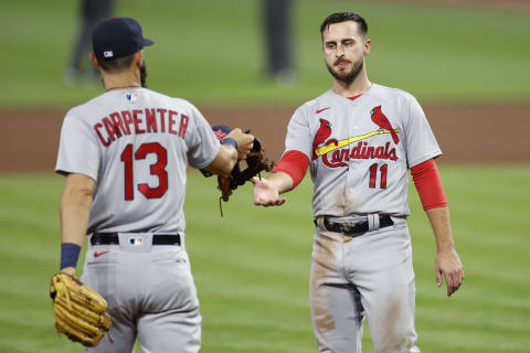 CINCINNATI, OH – SEPTEMBER 01: Paul DeJong #11 of the St Louis Cardinals receives his cap and glove from teammate Matt Carpenter #13 during a game against the Cincinnati Reds at Great American Ball Park on September 1, 2020 in Cincinnati, Ohio. The Cardinals defeated the Reds 16-2. (Photo by Joe Robbins/Getty Images)