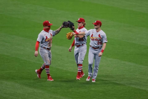 MILWAUKEE, WISCONSIN – SEPTEMBER 14: Tyler O’Neill #41, Harrison Bader #48, and Lane Thomas #35 of the St. Louis Cardinals celebrate after beating the Milwaukee Brewers 3-2 in game two of a doubleheader at Miller Park on September 14, 2020 in Milwaukee, Wisconsin. (Photo by Dylan Buell/Getty Images)