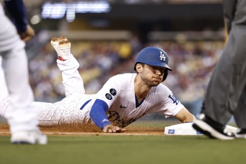 LOS ANGELES, CALIFORNIA – AUGUST 17: Trea Turner #6 of the Los Angeles Dodgers slides into third base (Photo by Michael Owens/Getty Images)