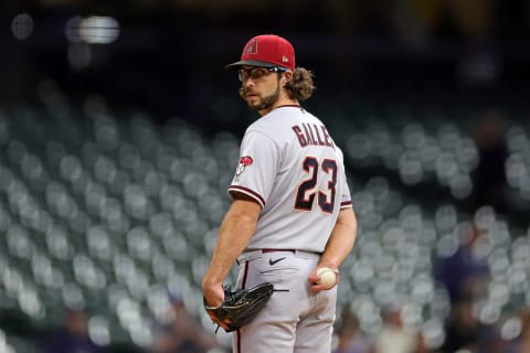 Zac Gallen #23 of the Arizona Diamondbacks checks a runner at first base. (Photo by Stacy Revere/Getty Images)