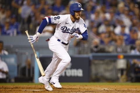 Cody Bellinger #35 of the Los Angeles Dodgers hits and reaches first base on a fielding error. (Photo by Ronald Martinez/Getty Images)