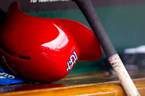 ST. LOUIS, MO – APRIL 28: A general shot of a St. Louis Cardinals helmet and a bat in the dugout during a game between the St. Louis Cardinals and the Milwaukee Brewers at Busch Stadium on April 28, 2012 in St. Louis, Missouri. The St. Louis Cardinals beat the Milwaukee Brewers 7-3. (Photo by David Welker/Getty Images)