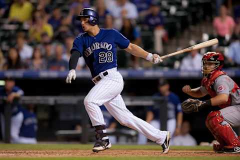 DENVER, CO – AUGUST 17: Nolan Arenado #28 of the Colorado Rockies grounds into an error, scoring two runs and allowing Arendao to reach second base during the second game of a split double header at Coors Field on August 17, 2014 in Denver, Colorado. (Photo by Dustin Bradford/Getty Images)