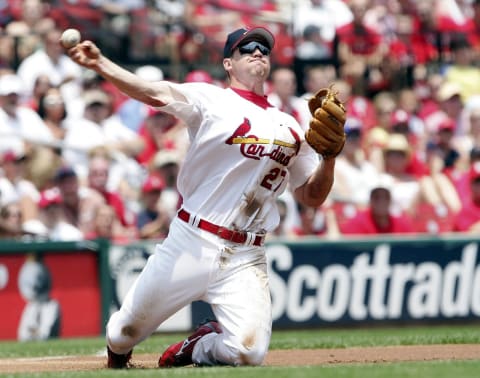 ST. LOUIS – JULY 2: Scott Rolen #27 of the St. Louis Cardinals fields the ball and sends it to first for the out against the Kansas City Royals on July 2, 2006 at Busch Stadium in St. Louis, Missouri. The St. Louis Cardinals defeated the Kansas City Royals 9-7. (Photo by Elsa/Getty Images)