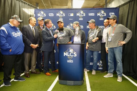 CHICAGO, IL – OCTOBER 19: Manager Dave Roberts of the Los Angeles Dodgers receives the Warren C. Giles Trophy after beating the Chicago Cubs 11-1 in game five of the National League Championship Series at Wrigley Field on October 19, 2017 in Chicago, Illinois. The Dodgers advance to the 2017 World Series. (Photo by Jamie Squire/Getty Images)