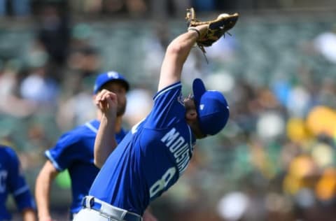 OAKLAND, CA – JUNE 09: Mike Moustakas #8 of the Kansas City Royals falls backwards to catch a pop-up on the infield off he bat of Matt Olson #28 of the Oakland Athletics in the bottom of the seventh inning at the Oakland Alameda Coliseum on June 9, 2018 in Oakland, California. (Photo by Thearon W. Henderson/Getty Images)