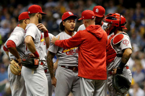 MILWAUKEE, WI – JUNE 21: Pitching coach Mike Maddux meets with Carlos Martinez #18 in the fourth inning against the Milwaukee Brewers at Miller Park on June 21, 2018 in Milwaukee, Wisconsin. (Photo by Dylan Buell/Getty Images)