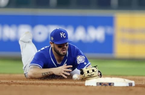 HOUSTON, TX – JUNE 24: Mike Moustakas #8 of the Kansas City Royals tries to corral the ball against the Houston Astros at Minute Maid Park on June 24, 2018 in Houston, Texas. (Photo by Bob Levey/Getty Images)