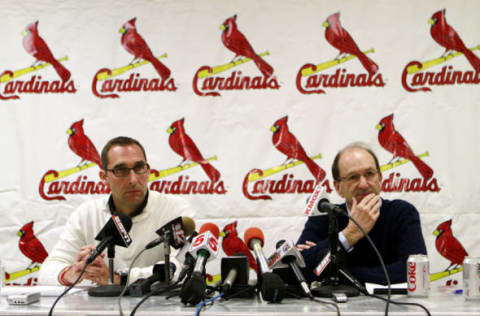 JUPITER, FL – FEBRUARY 16: General Manager John Mozeliak (L) and owner William DeWitt, Jr. of the St. Louis Cardinals speak at a press conference at Roger Dean Stadium on February 16, 2011 in Jupiter, Florida. (Photo by Marc Serota/Getty Images)