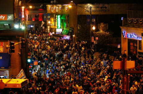 CHICAGO, IL – OCTOBER 22: Chicago Cubs fans celebrate outside of Wrigley Field after the Chicago Cubs defeated the Los Angeles Dodgers 5-0 in game six of the National League Championship Series to advance to the World Series against the Cleveland Indians on October 22, 2016 in Chicago, Illinois. (Photo by Jamie Squire/Getty Images)