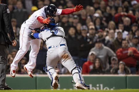 BOSTON, MA – APRIL 11: Rafael Devers #11 of the Boston Red Sox is tagged out by Danny Jensen #9 of the Toronto Blue Jays as he attempts to tag up during the fifth inning of a game on April 11, 2019 at Fenway Park in Boston, Massachusetts. (Photo by Billie Weiss/Boston Red Sox/Getty Images)