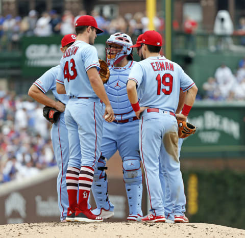 CHICAGO, ILLINOIS – SEPTEMBER 21: Yadier Molina #4 of the St. Louis Cardinals speaks with Dakota Hudson #43 during a mound gathering during the first inning of a game against the Chicago Cubs at Wrigley Field on September 21, 2019 in Chicago, Illinois. (Photo by Nuccio DiNuzzo/Getty Images)