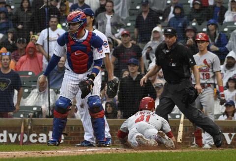 CHICAGO, ILLINOIS – SEPTEMBER 22: Tyler O’Neill #41 of the St. Louis Cardinals is safe at home plate as Victor Caratini #7 of the Chicago Cubs waits for a late throw during the ninth inning at Wrigley Field on September 22, 2019 in Chicago, Illinois. (Photo by David Banks/Getty Images)