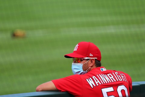 ST LOUIS, MO – JULY 22: Adam Wainwright #50 of the St. Louis Cardinals stands in the dugout prior to playing in a MLB exhibition game against the Kansas City Royals at Busch Stadium on July 22, 2020 in St Louis, Missouri. (Photo by Dilip Vishwanat/Getty Images)