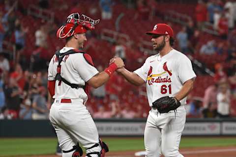 ST LOUIS, MO – MAY 11: Jake Walsh #61 and Andrew Knizner #7 of the St. Louis Cardinals celebrate their 10-1 victory over the Baltimore Orioles at Busch Stadium on May 11, 2022 in St Louis, Missouri. (Photo by Joe Puetz/Getty Images)