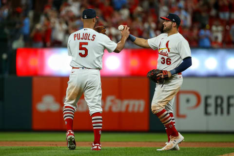 ST. LOUIS, MO – MAY 15: Juan Yepez #36 of the St. Louis Cardinals hands Albert Pujols #5 the game ball after Pujols pitched the final out in the teams victory against the San Francisco Giants at Busch Stadium on May 15, 2022 in St. Louis, Missouri. (Photo by Scott Kane/Getty Images)