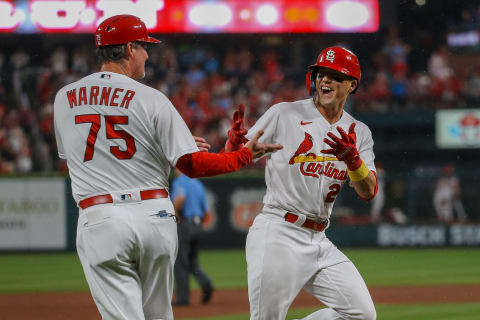 Ron ‘Pop’ Warner #75 congratulates Lars Nootbaar #21 of the St. Louis Cardinals. (Photo by Scott Kane/Getty Images)